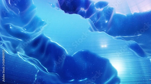 fantastical festive blue bg. Stylish abstract looped background, waves move on glossy surface like landscape made of liquid blue wax with sparkles. Beautiful soft background with smooth animation 4k photo