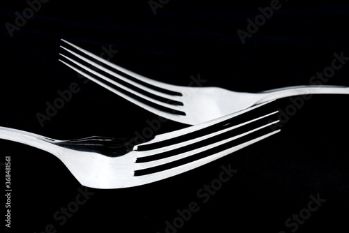 Silver ware on a black cloth