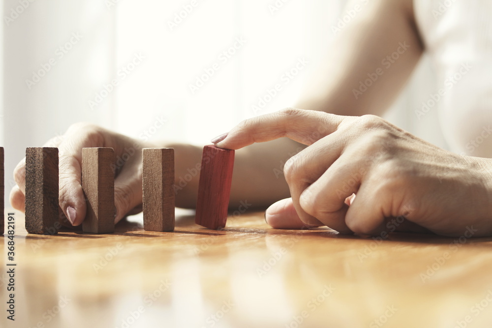 woman using a hand to block the wood
