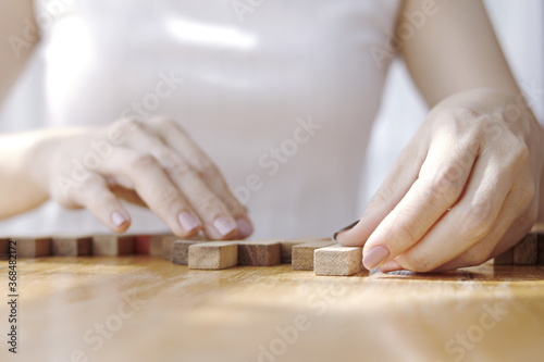 woman using a hand to block the wood