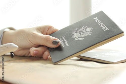  woman hand has a United States passport, Tourism concept