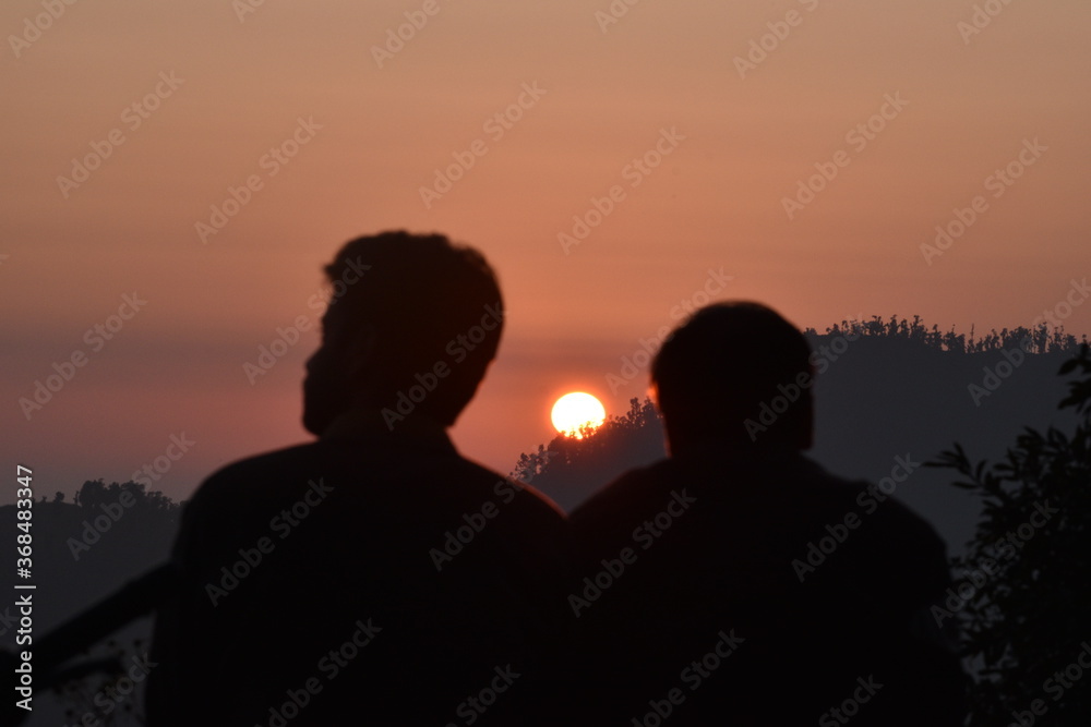 Beautiful Sunset and two people in Nainital