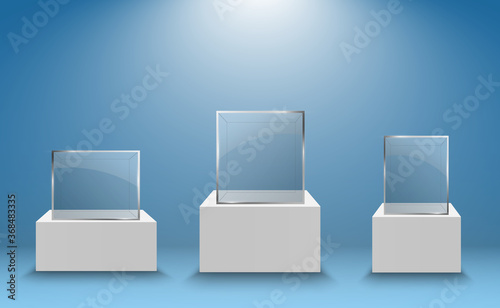 Glass showcase for the exhibition in the form of a cube. Background for sale illuminated by spotlights. Museum glass box isolated advertising or business design boutique. Exhibition hall.