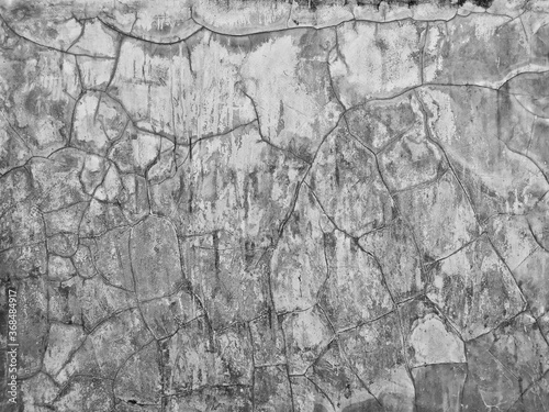 Scratch and cracked old concrete wall for abstract background and texture.