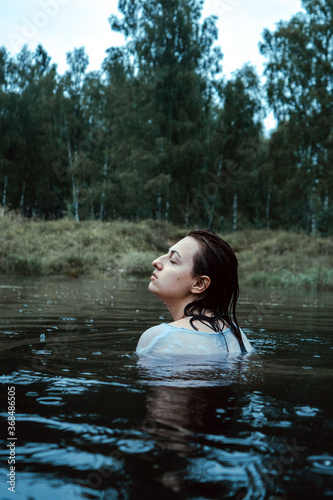 Beautiful young woman in in the lake