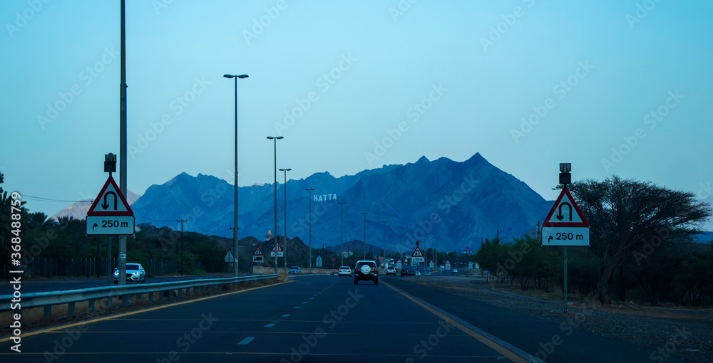 View of Hatta mountains in UAE and the road