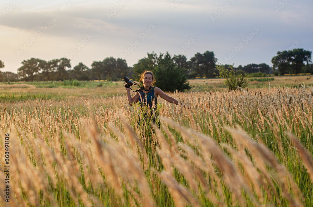 free girl walks in the field. free girl walks in the field.