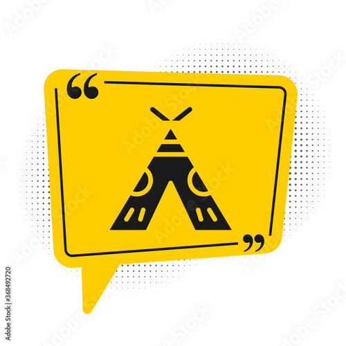 Black Traditional indian teepee or wigwam icon isolated on white background. Indian tent. Yellow speech bubble symbol. Vector Illustration.