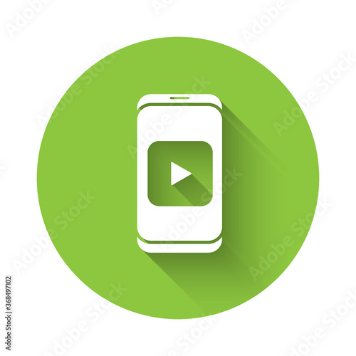 Free Download White Online play video icon isolated with long shadow. Smartphone and film strip with play sign. Green circle button. Vector Illustration. - GFXLoad