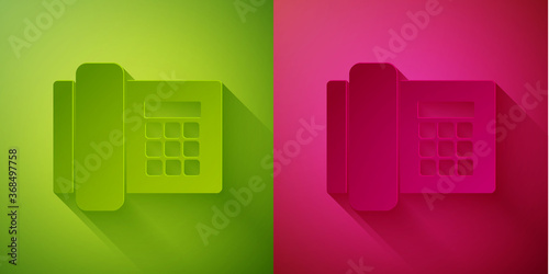 Paper cut Telephone icon isolated on green and pink background. Landline phone. Paper art style. Vector Illustration.