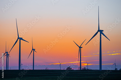 Kansas Wind Farm with agriculture at sunset photo