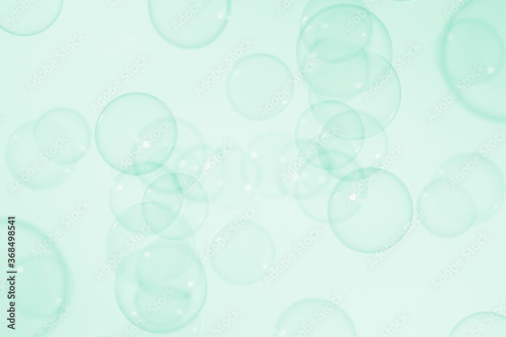 transparent clear green soap bubbles background.