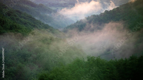 Magic foggy sunset in transylvaninan mountains. © erika8213
