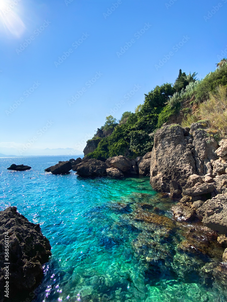 Antalya platform beach, a view of the rocky coast. Antalya, Turkey Antalya platform beach, a view of the rocky coast. Antalya, Turkey