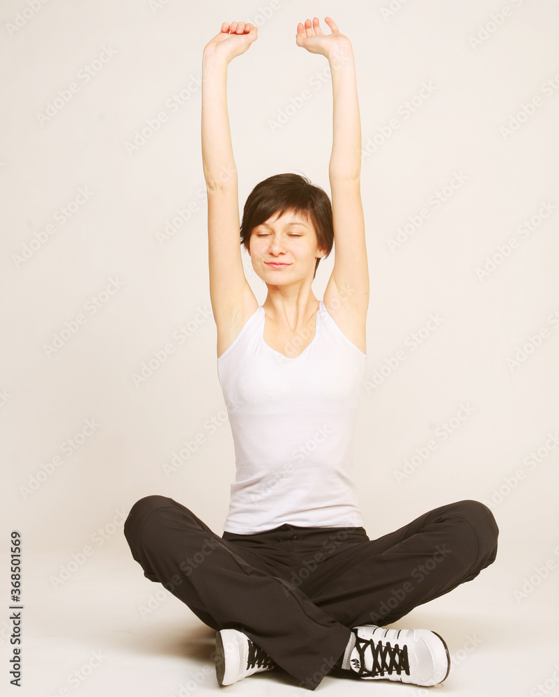 woman doing stretching exercise at the gym woman doing stretching exercise at the gym