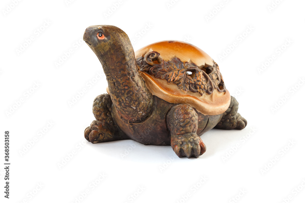 Naklejka premium Wooden turtle figurine isolated on white background.