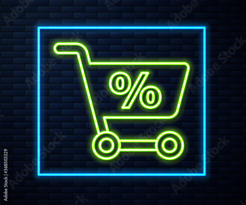 Glowing neon line Shopping cart icon isolated on brick wall background. Online buying concept. Delivery service sign. Supermarket basket symbol. Vector Illustration.