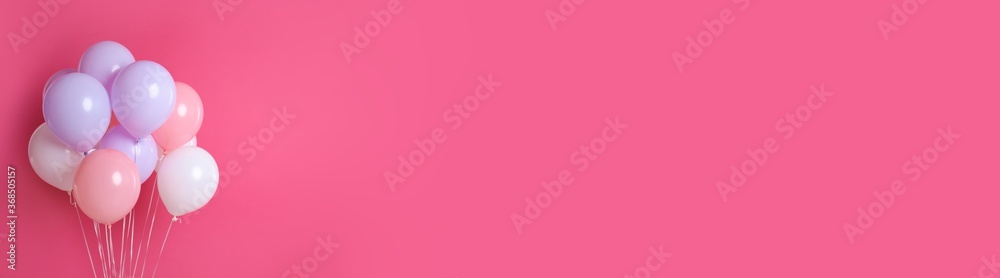 Bunch of color balloons on pink background, space for text. Banner design