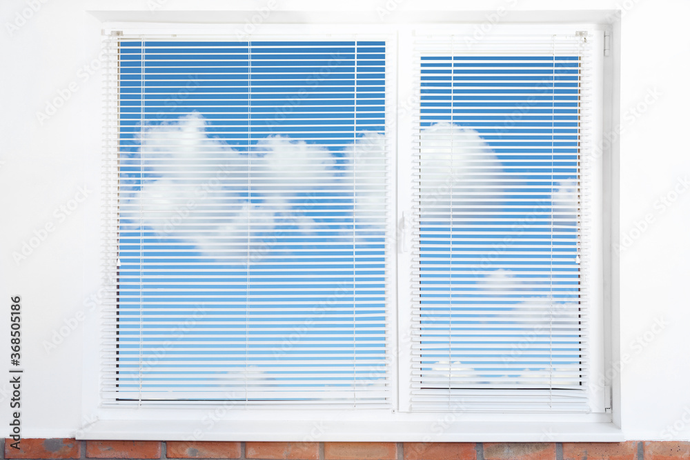 Beautiful view on blue sky with clouds through window Beautiful view on blue sky with clouds through window