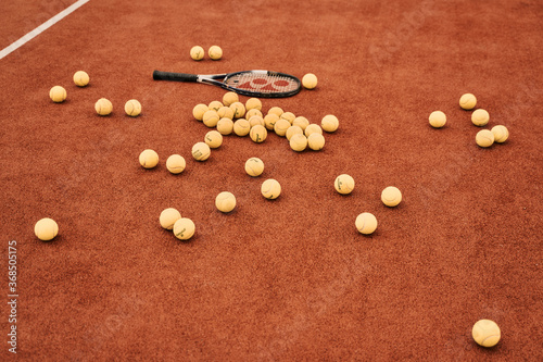 Tennis balls scattered around the court