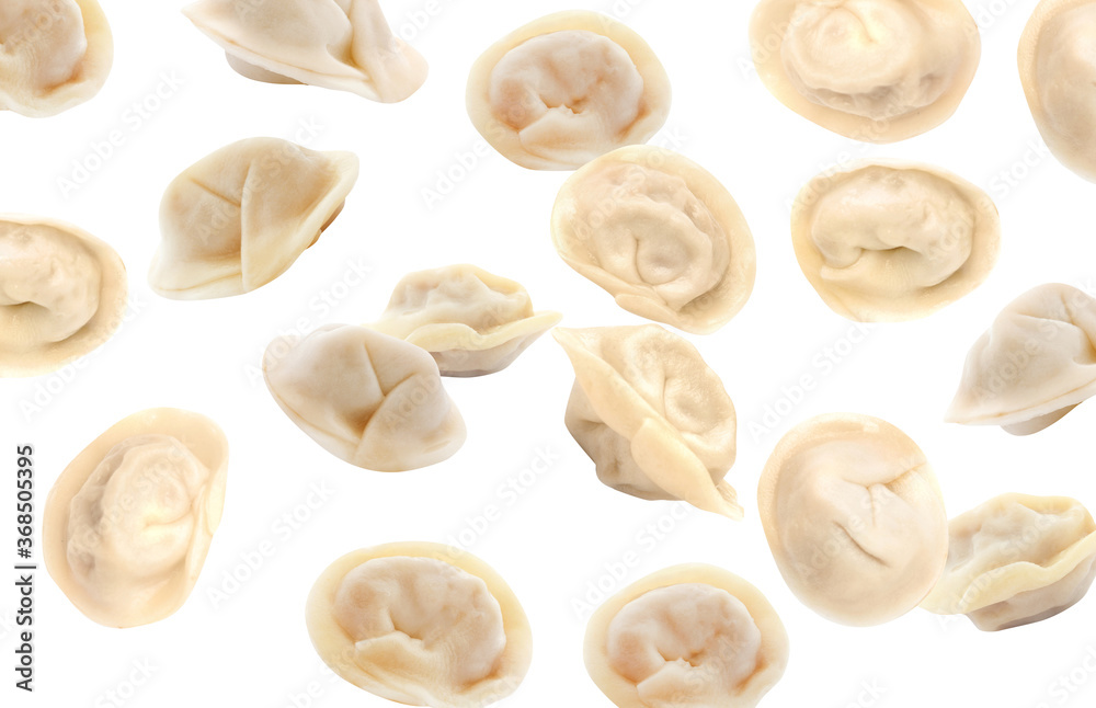 Many tasty dumplings falling on white background Many tasty dumplings falling on white background