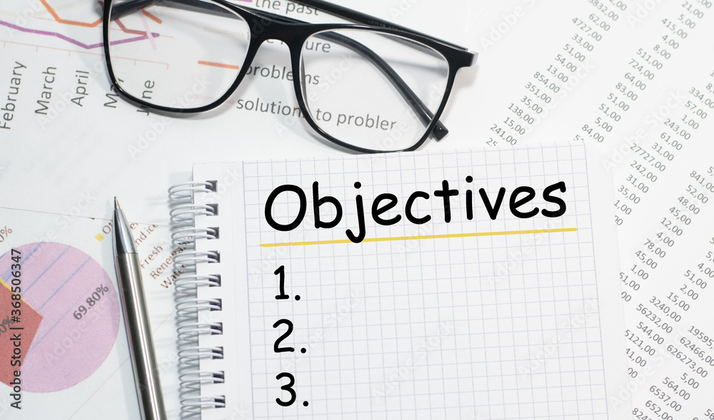 OBJECTIVES writing on the Notepad view from above business concepts OBJECTIVES writing on the Notepad view from above business concepts