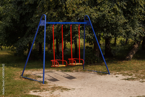 Colorful children's swing in the park