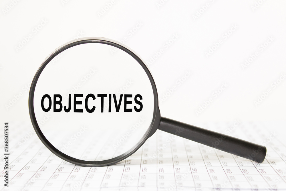 magnifying glass with an inscription in the middle OBJECTIVES. finance magnifying glass with an inscription in the middle OBJECTIVES. finance