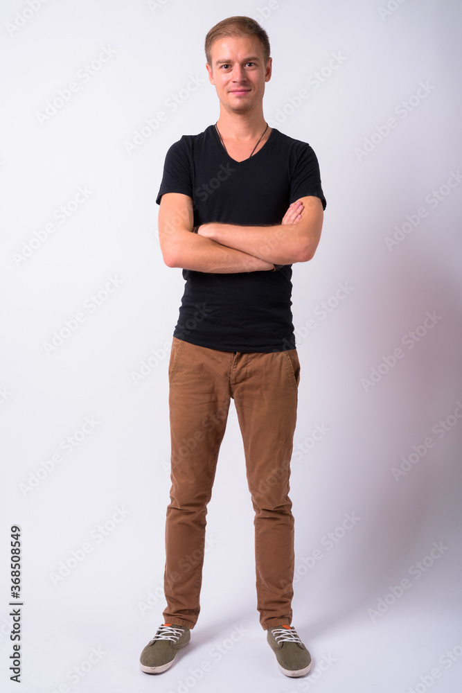 Fototapeta premium Portrait of handsome man against white background