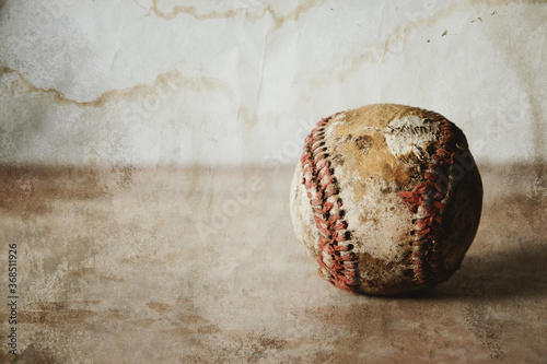 Old vintage baseball banner with grunge texture of ball and copy space on background for sport.