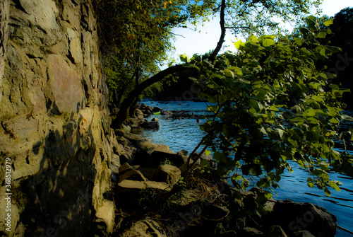 Mountain side view on water