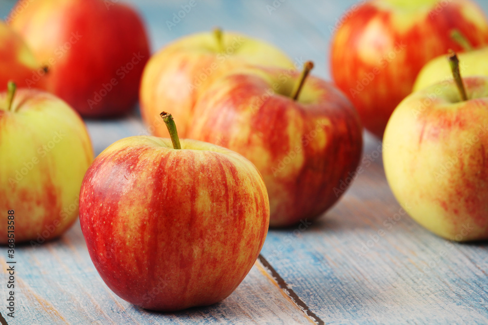 Several ripe red apples on the wooden table Several ripe red apples on the wooden table