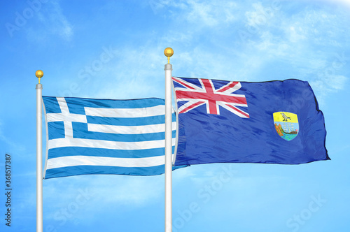 Greece and Saint Helena two flags on flagpoles and blue sky photo