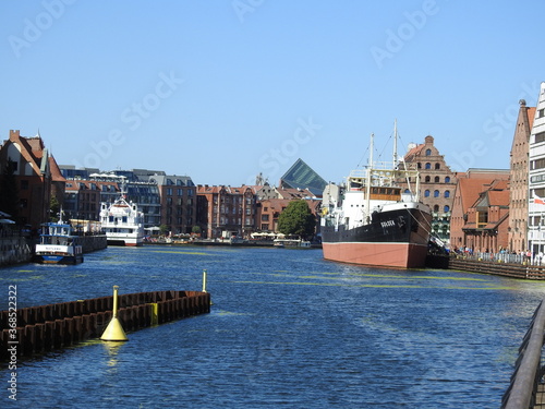Motława in Gdańsk - the Sołdek ship and numerous tenement houses