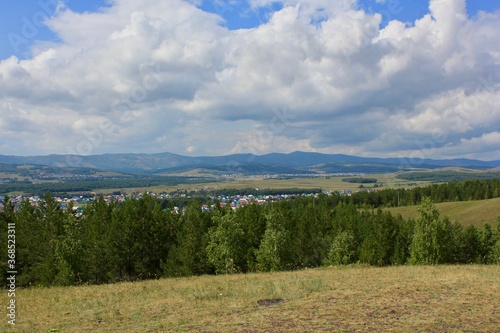 Breathtaking summer landscape Blue sky Fresh air of the Forest Field Mountains