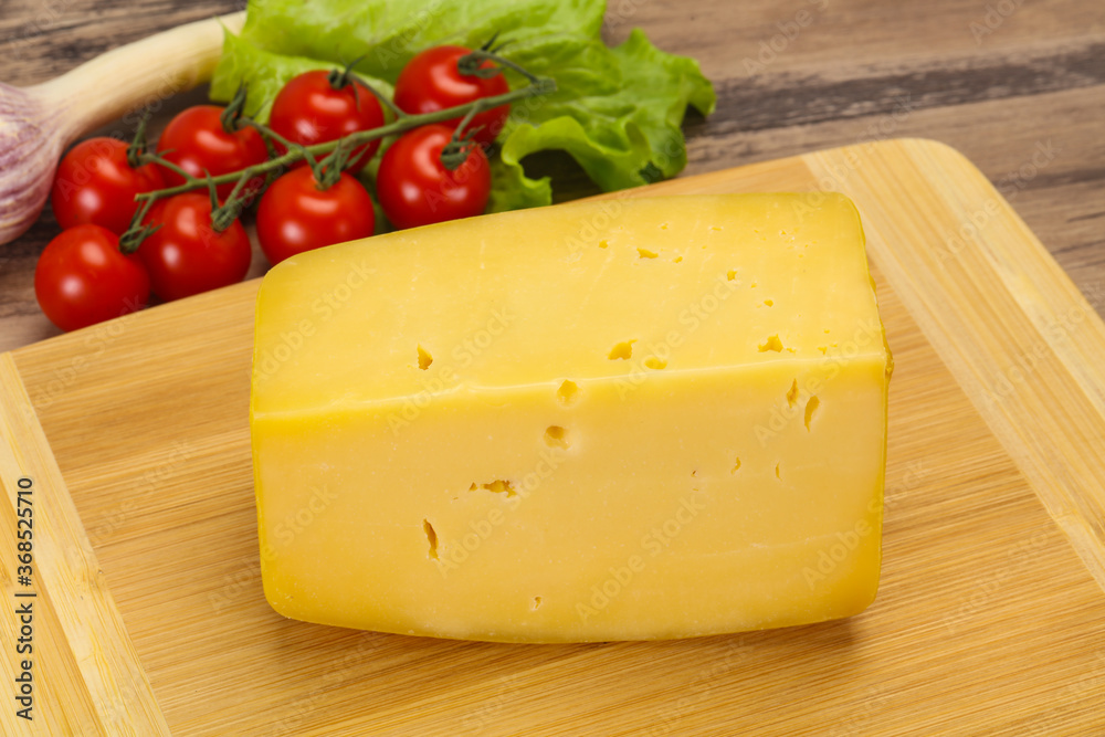 Hard yellow tasty cheese brick Hard yellow tasty cheese brick