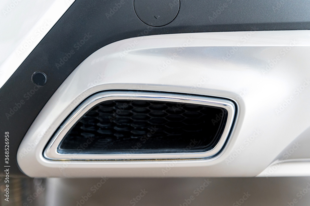 Exhaust pipe of a modern white car