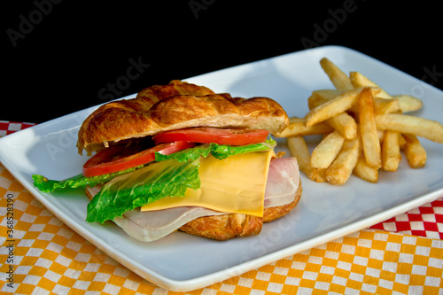 Organic turkey croissant and french fries