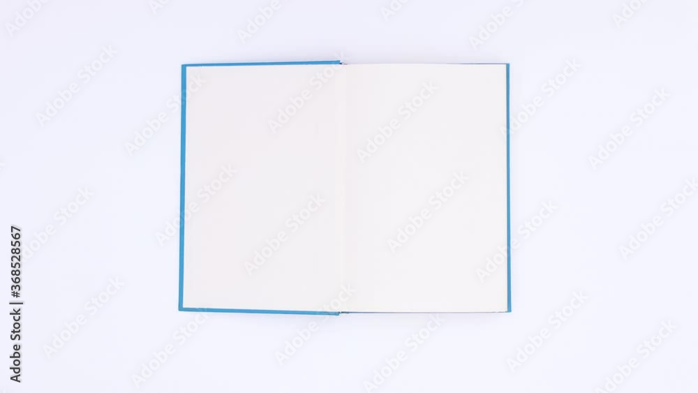 Blue book appear open and close on white background. Stop motion 