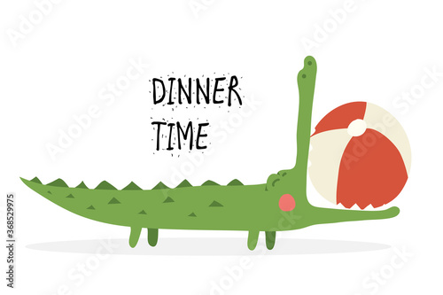Funny crocodile with open mouth eats the ball