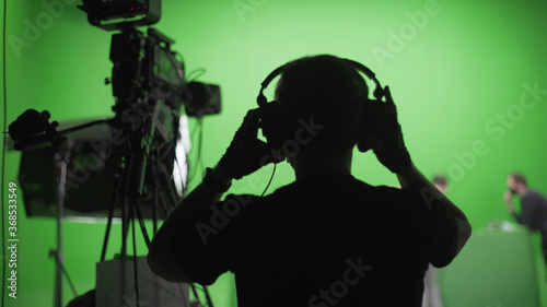 Film Crew in Green Studio