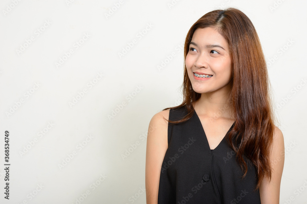 Portrait of happy young beautiful Asian woman Portrait of happy young beautiful Asian woman