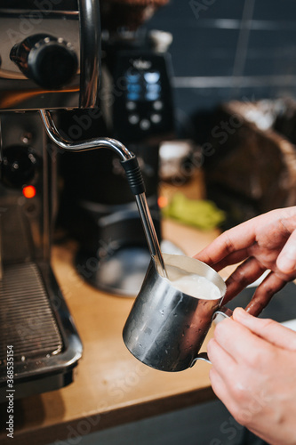 The art of barista in making coffee - professional brewing on expensive equipment