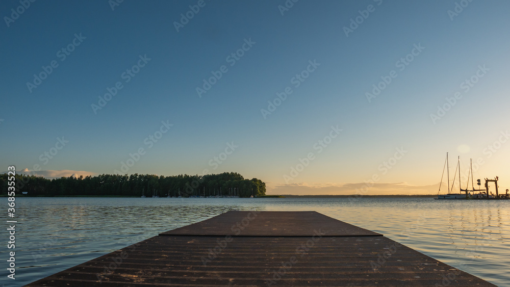 Wooden pier On Masurian lake.