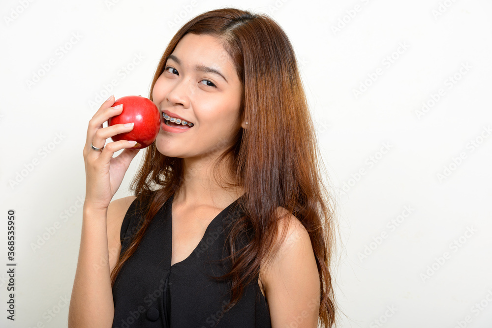 Portrait of happy young beautiful Asian woman Portrait of happy young beautiful Asian woman
