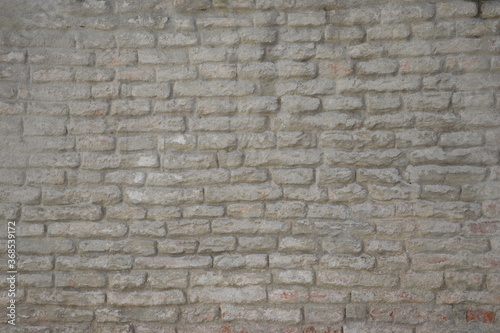 Old brickwork with plaster remnants