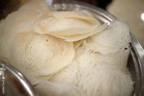 Appam, Palappam,Kallappam,vella appam,parotta,Roti or Chapati a popular traditional Kerala breakfast food. photo