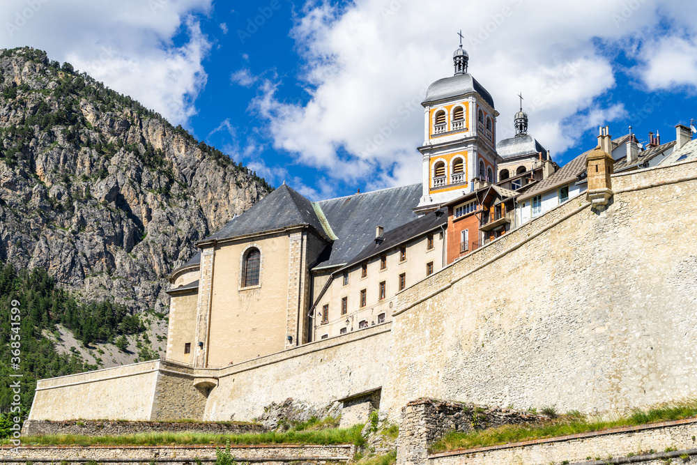 The Collegiate Church of Notre-Dame and Saint-Nicolas overlooking Briancon city walls, Huates Alpes, France