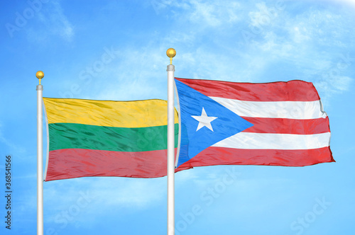 Lithuania and Puerto Rico two flags on flagpoles and blue sky
