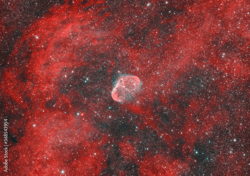 Close up of crescent emission nebula also known as NGC 6888 in the Cygnus constellation. At the center the star Wolf Rayet. It is supposed to be a supernova remnant.